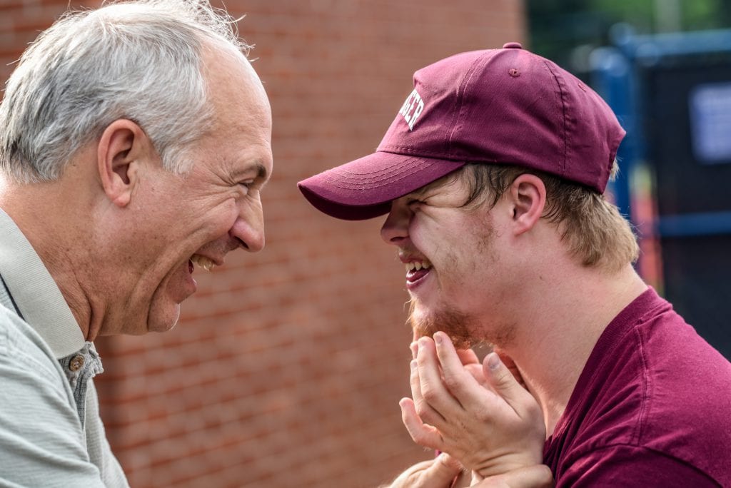 Two smiling men image for corporate trustee RFP