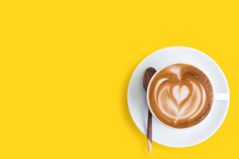 coffee against a sunny yellow background