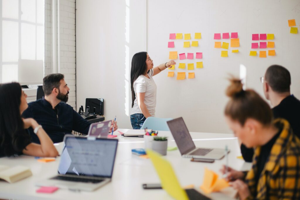 Woman presenting with Post-Its.