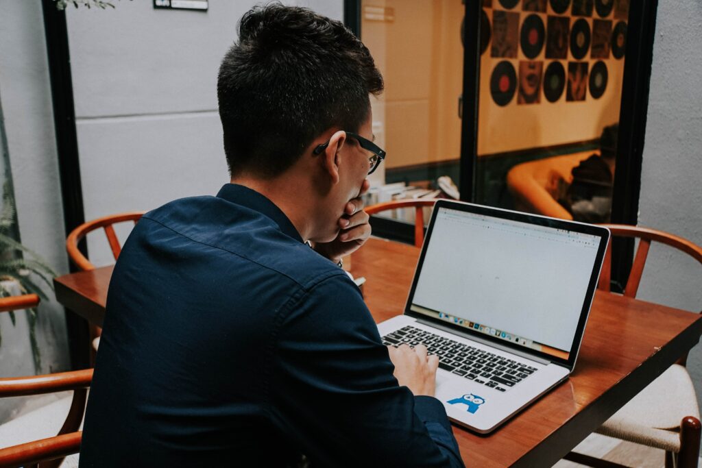 Image of a person looking at their computer.