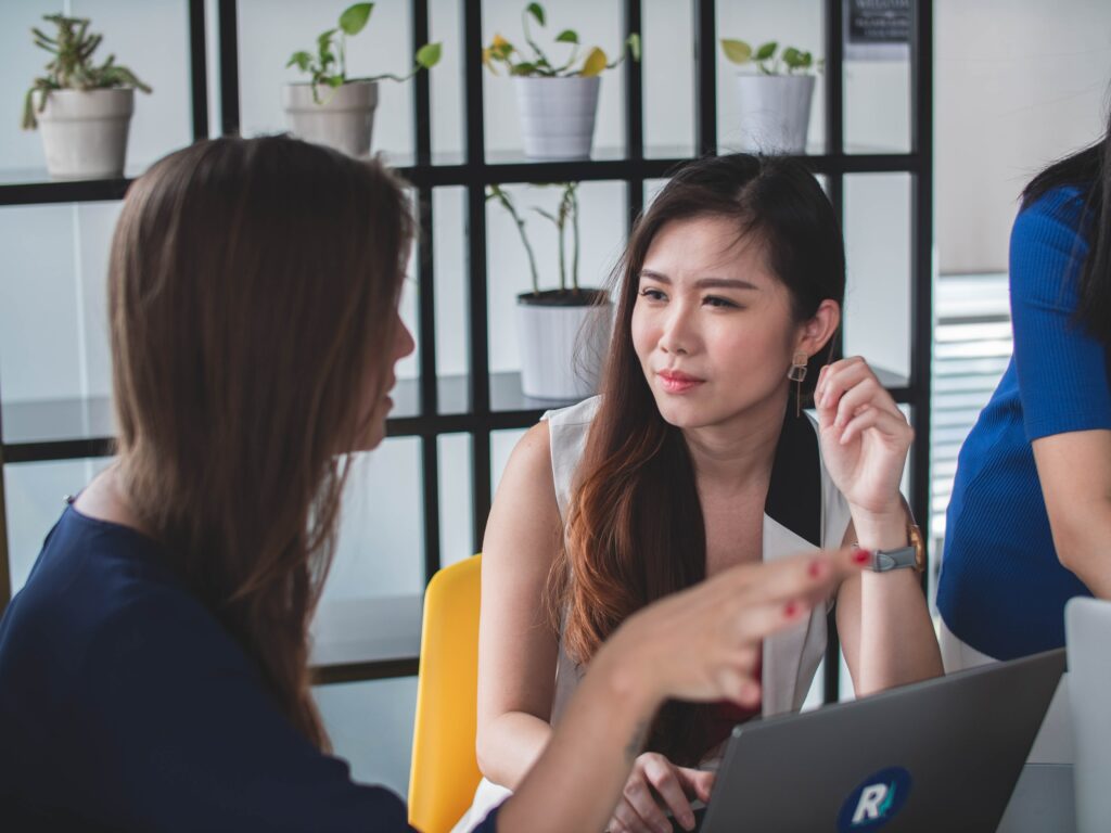Two coworkers listening to each other. 